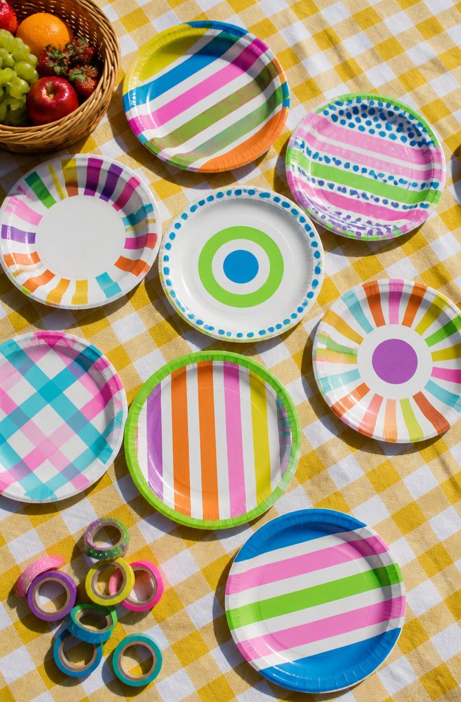 Plain paper plates covered in colorful washi tape designs.