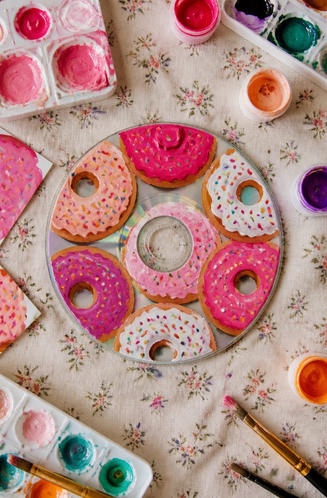 25 CD Painting Ideas for an Aesthetic Look, Easy to Copy 20 Multiple CDs display donuts with different frosting colors and sprinkles.