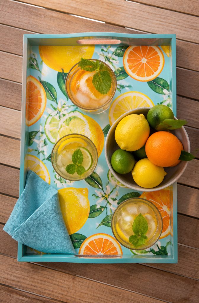 A serving tray painted with citrus fruit patterns.