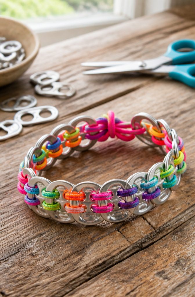 20 Crafts to Do With Soda Tabs: Easy Pop Tab Ideas 1 A bracelet crafted from aluminum soda tabs and elastic cord.