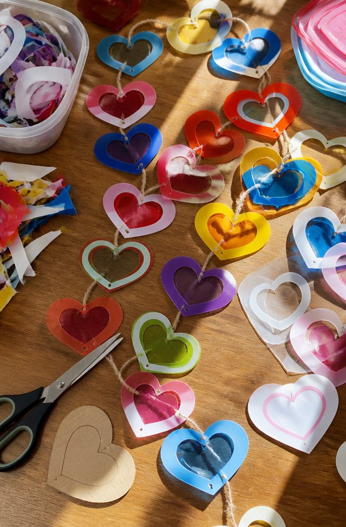 Hearts cut from plastic tubs, ready to be used as decorations or gift tags.