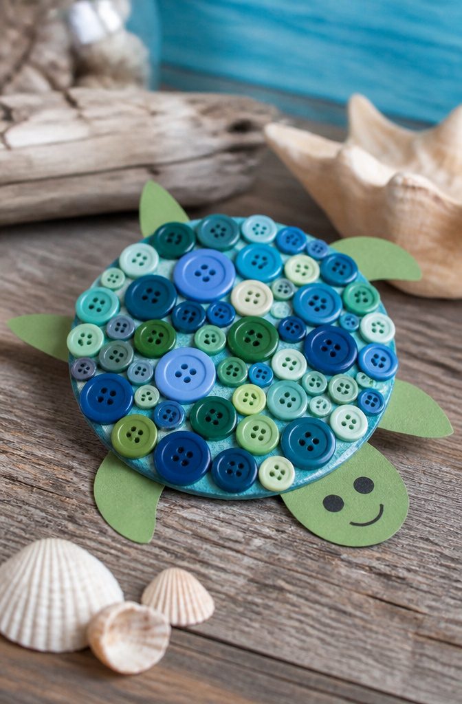 25 DIY CD Decor Ideas for Walls, Desks and Home Corners 6 Turtle made from buttons and cardstock on the back of a CD.