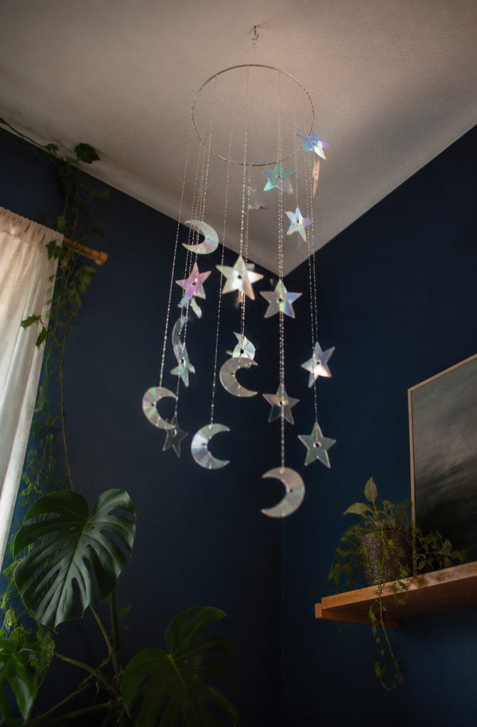 25 DIY CD Decor Ideas for Walls, Desks and Home Corners 19 Mobile of stars and moons crafted from old CDs.