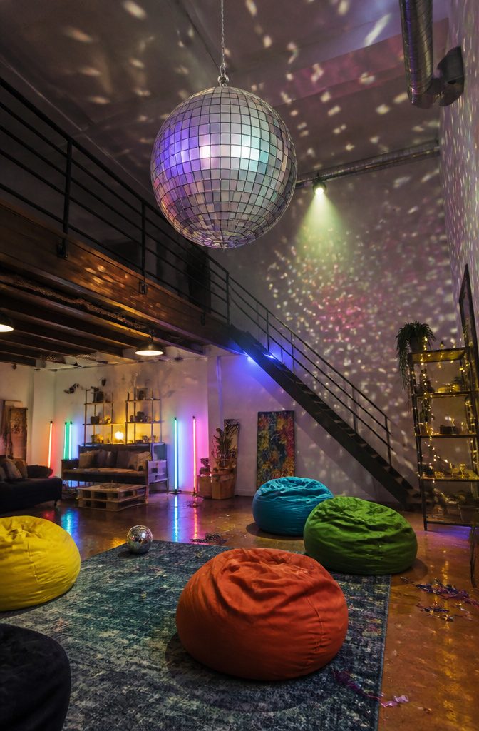 16 DIY with CD Ideas: Easy Upcycled Crafts for Old Discs 9 A disco ball covered in squares of CDs hanging from the ceiling.