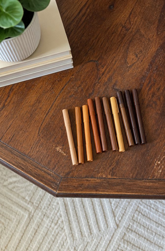 How to Do Easy DIY Home Projects: 23 Ideas for Any Room 9 Thirteen wood repair markers arranged in a display on a table.