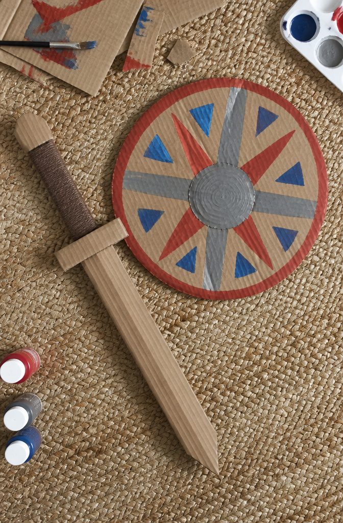 25 Ideas to Make Stuff Out of Cardboard at Home 12 Cardboard sword and shield crafted for children's play.