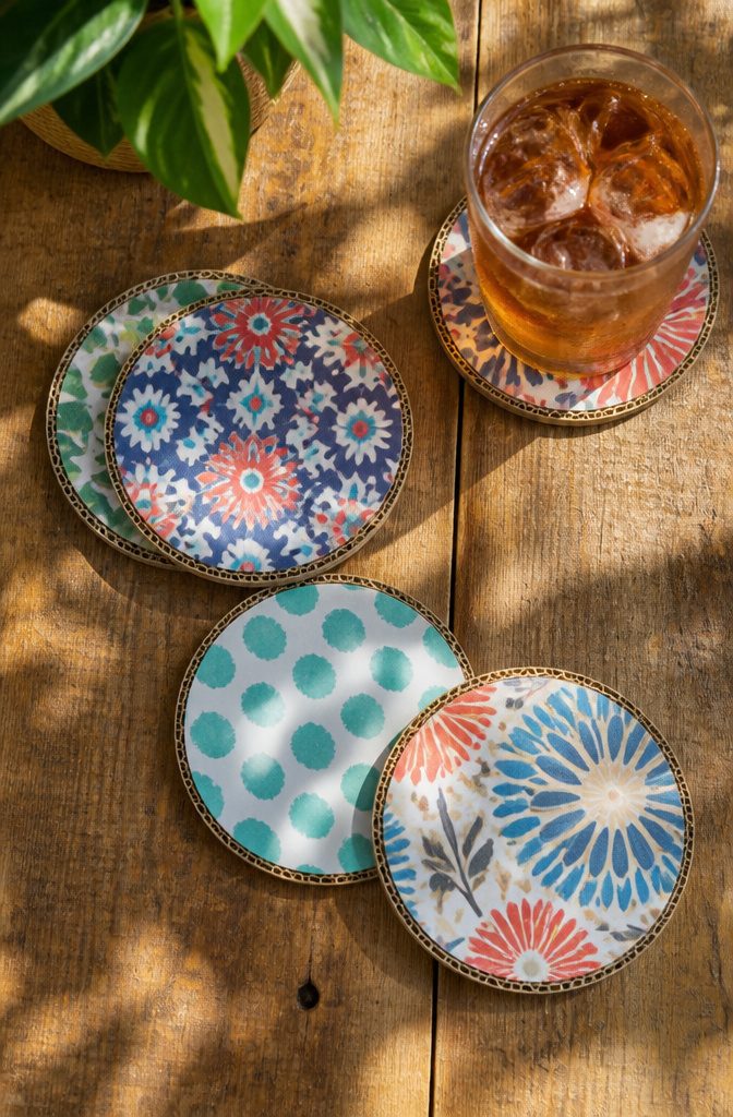 25 Ideas to Make Stuff Out of Cardboard at Home 1 Cardboard circles stacked to form coasters on a surface.