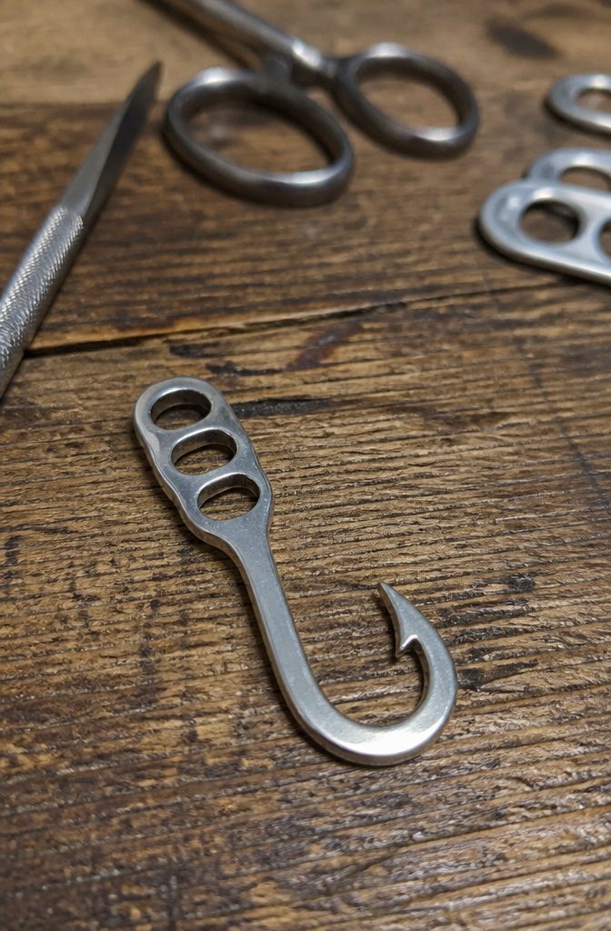 Pop Tab Crafts: Upcycled Projects Made From Soda Can Tabs 13 A pop tab fashioned into a fishing hook.