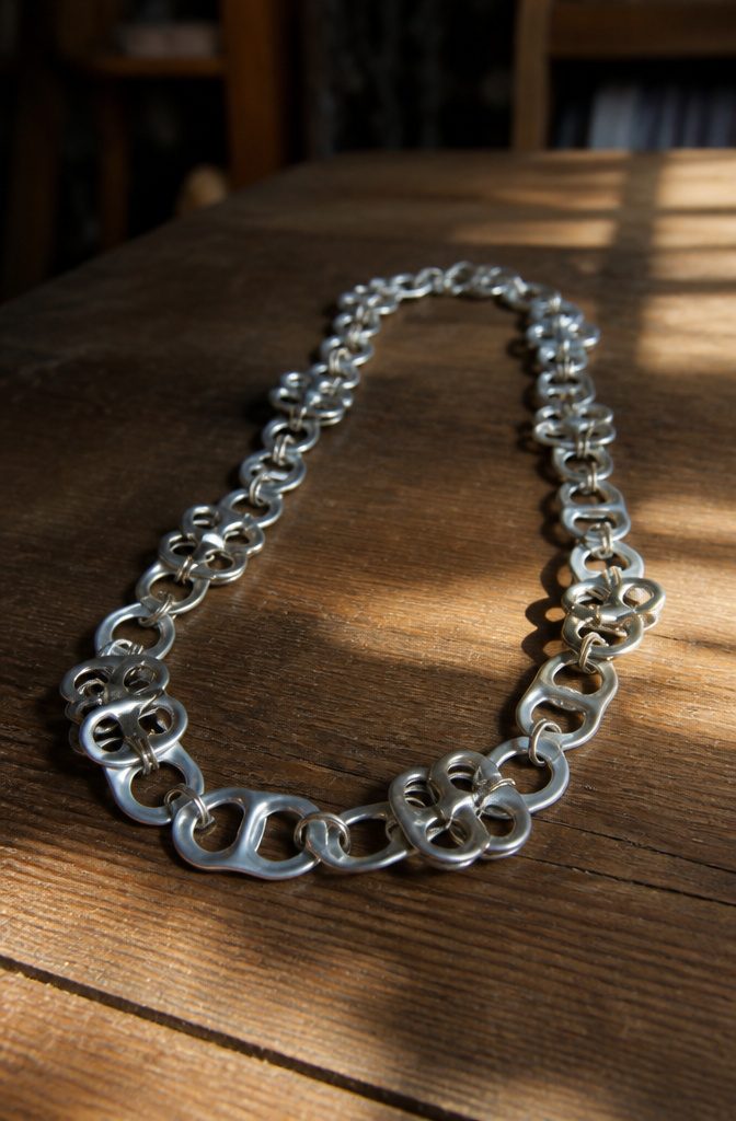 Pop Tab Crafts: Upcycled Projects Made From Soda Can Tabs 5 A necklace made from pop tabs and jump rings.
