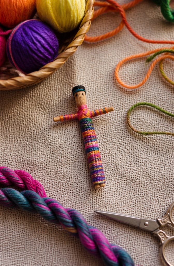 A Guatemalan worry doll wrapped in colorful yarn.